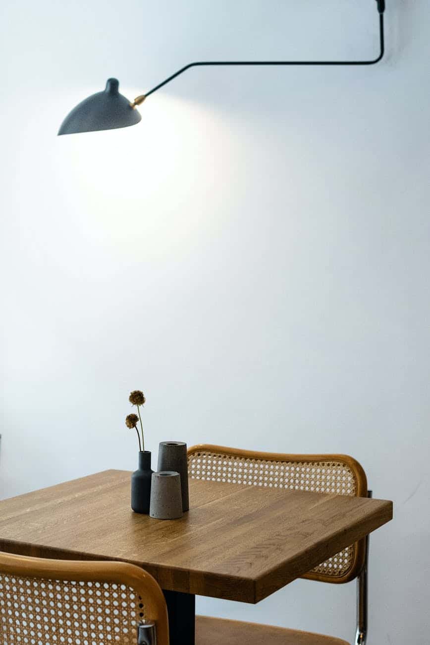 minimalist interior style with wooden table and chairs at home