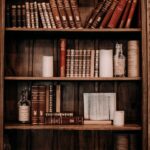 books arranged on a wooden bookcase